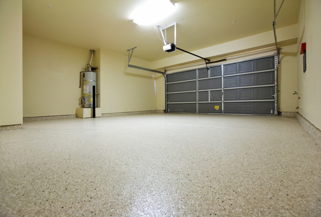 garage floor with concrete coating and water heater still installed